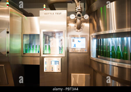 AMSTERDAM, NETHERLANDS - JUN 3, 2015: Bottles of Heineken at the Heineken Experience center, a historic brewery for Heineken beer. Gerard Adriaan Hein Stock Photo