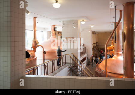 AMSTERDAM, NETHERLANDS - JUN 3, 2015: Bottles of Heineken at the Heineken Experience center, a historic brewery for Heineken beer. Gerard Adriaan Hein Stock Photo