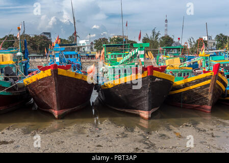 Fishing boats moored up on the Ca Ty River in Phan Tiet, Vietnam Stock Photo