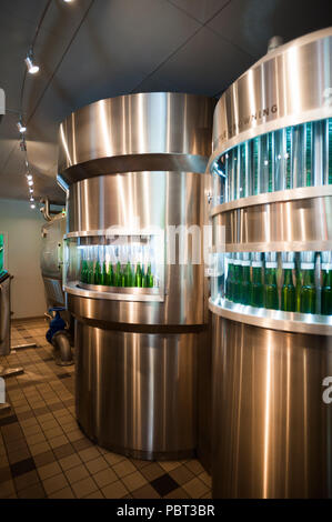 AMSTERDAM, NETHERLANDS - JUN 3, 2015: Bottles of Heineken at the Heineken Experience center, a historic brewery for Heineken beer. Gerard Adriaan Hein Stock Photo