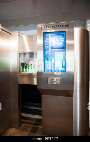 AMSTERDAM, NETHERLANDS - JUN 3, 2015: Bottles of Heineken at the Heineken Experience center, a historic brewery for Heineken beer. Gerard Adriaan Hein Stock Photo