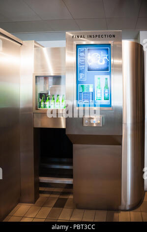 AMSTERDAM, NETHERLANDS - JUN 3, 2015: Bottles of Heineken at the Heineken Experience center, a historic brewery for Heineken beer. Gerard Adriaan Hein Stock Photo