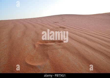 Foot steps marks on the sand dunes in the desert Stock Photo