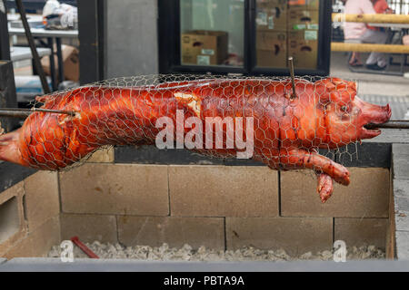 BBQ Hog on spit pig barbeque Stock Photo