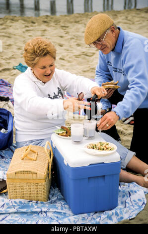Senior couple enjoying picnic on the beach  MR.  © Myrleen Pearson  .....Ferguson Cate Stock Photo