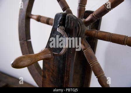 Vintage romanian spinning wheel for spinning thread or yarn from natural or  synthetic fibres Stock Photo - Alamy