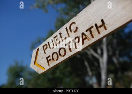 New Public Footpath sign on the path around the beautiful Bosham Harbour, on a bright summers day Stock Photo
