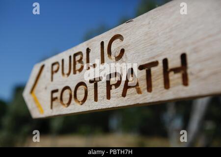 New Public Footpath sign on the path around the beautiful Bosham Harbour, on a bright summers day Stock Photo
