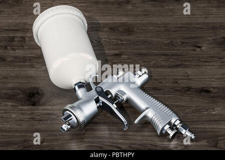 Painting spray gun on the wooden background, 3D rendering Stock Photo