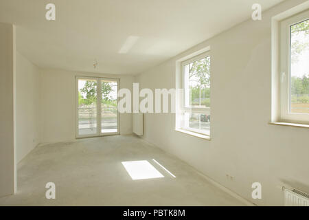 Empty unfinished renovated room in a new constructed building Stock Photo
