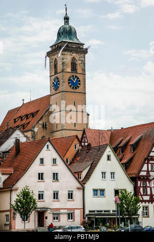 The gothic Stadtkirche St. Laurentius or Church of St. Laurence, is surrounded by picturesque residential and marketplaces in Nurtingen, Germany Stock Photo