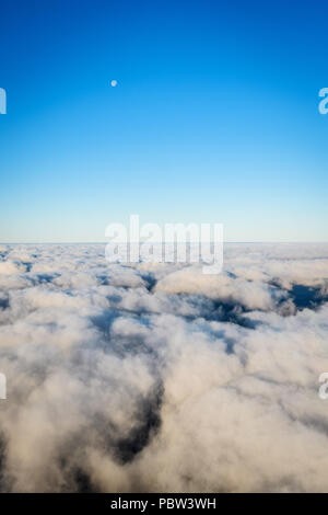 Aerial view from airplane  window with the sky and cloud and moon