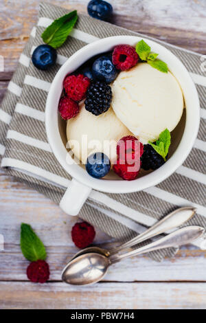 Vanilla ice cream with berries Stock Photo