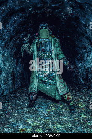 Post apocalyptic survivor in abandoned tunnel Stock Photo