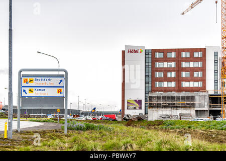 Keflavik, Iceland - June 14, 2018: Hotel at Airport in Scandinavian city by Reykjavik with information direction signs, modern building construction,  Stock Photo