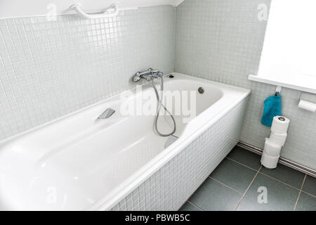 New clean staging model home, house, hotel hostel or apartment guesthouse shower bath bathroom interior, nobody, toilet paper in Iceland Stock Photo
