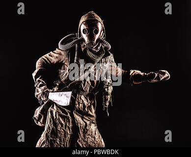 Survived in ecological cataclysm human in gas mask Stock Photo