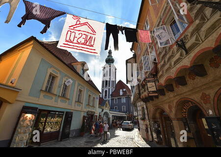 The Czechoslovak pavilion at the architecture exhibition in Venice (La Binnale di Venezia) shows the life in a town full of tourists, the UNESCO-listed Cesky Krumlov, south Bohemia, within a project of Czech artist Katerina Seda. During six months of the 16th International Biennale of Architecture in Venice 2018, the pavilion will turn into the seat of the fictitious firm UNES-CO, (which means KIDNAP-WHAT in Czech). Along with several volunteers, it is trying to bring normal life into Ceske Krumlov, which is exploited by tourism. The firm made up by Seda therefore employs people only to carry Stock Photo