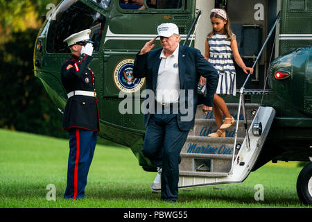 U.S. President Donald J. Trump (L) and his granddaughter Arabella Rose Kushner (R) walk off Marine One as they return from a weekend stay in Bedminster, New Jersey at the White House in Washington, DC, USA, 29 July 2018. Earlier in the day, the President once again went after the media on Twitter, calling them the 'enemy of the people.' Credit: Jim LoScalzo/Pool via CNP /MediaPunch Stock Photo