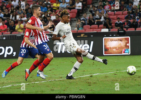 Singapore. 30th July, 2018. Paris Saint-Germain's Christopher Nkunku (R) shoots and scores during the International Champions Cup match between Paris Saint-Germain and Atletico de Madrid held in Singapore on July 30, 2018. Credit: Then Chih Wey/Xinhua/Alamy Live News Stock Photo