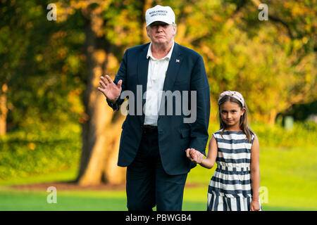 U.S. President Donald J. Trump (L) and his granddaughter Arabella Rose Kushner (R) walk across the South Lawn as they return from a weekend stay in Bedminster, New Jersey at the White House in Washington, DC, USA, 29 July 2018. Earlier in the day, the President once again went after the media on Twitter, calling them the 'enemy of the people.' Credit: Jim LoScalzo/Pool via CNP /MediaPunch Stock Photo
