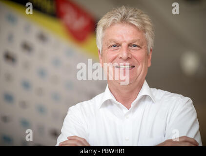 30 July 2018, Germany, Gruenheide, Kienbaum, summer party at the training centre, press conference German Athletics Association: Juergen Kessing, President of the German Athletics Association DLV, smiles at the photocall. A week before the start of the European Athletics Championships in Berlin 250.000 tickets have been sold. That is what the president of the athletics federation said on Monday. Photo: Michael Kappeler/dpa Stock Photo