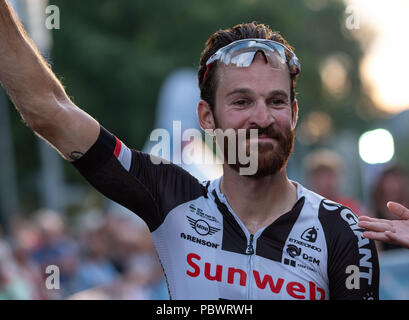 Hanover, Germany. 30th July, 2018. 30.07.2018, Lower Saxony, Hanover:Cycling: The professional cyclist Simon Geschke, Team Sunweb, smiles before the 'Die Nacht' race about 850 meters long circuit in front of the New Town Hall in Hanover. Credit: Peter Steffen/dpa/Alamy Live News Stock Photo