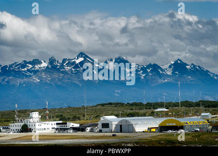 Ushuaia airport buildings and flyine club 'Aero Club Ushuaia' with the Chillian Mountains in the background Stock Photo