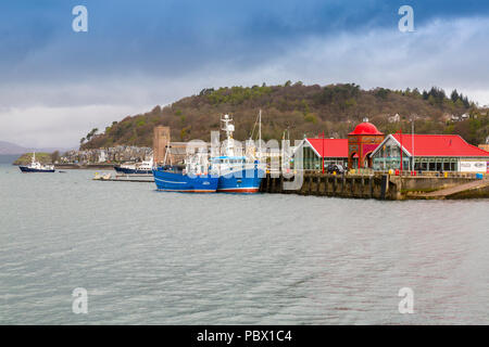 Two colourful fishing boats moored at the original North Pier in Oban, Argyll and Bute, Scotland, UK Stock Photo