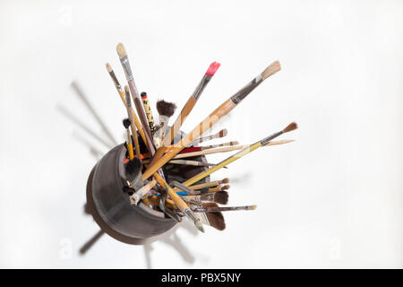 top view of a boat with a cluttered group of brushes of various shapes and sizes Stock Photo