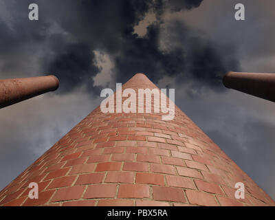 Three billowing brick smokestacks with dark stormy sky. Stock Photo