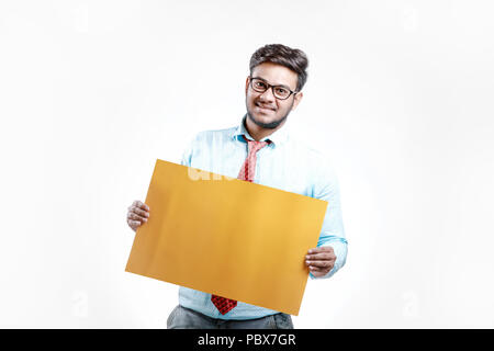 happy Young indian man showing blank poster Stock Photo