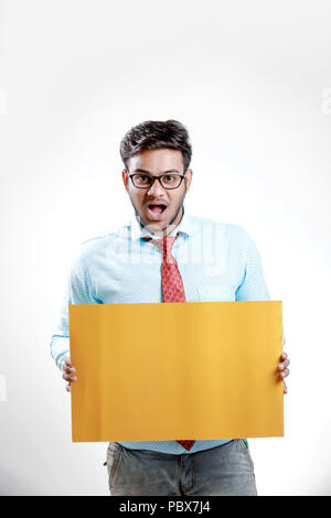 happy Young indian man showing blank poster Stock Photo