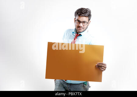 happy Young indian man showing blank poster Stock Photo