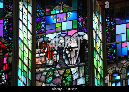 Stained glass window by Harry Clarke Studio at  All Saints Church in Drimoleague Stock Photo