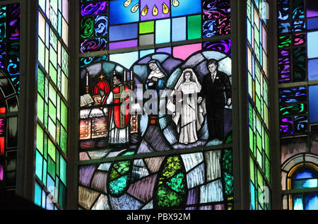 Stained glass window by Harry Clarke Studio at  All Saints Church in Drimoleague Stock Photo