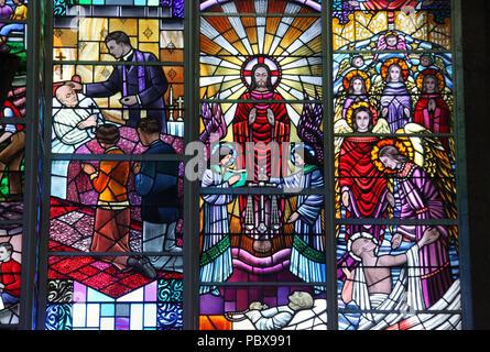 Stained glass window by Harry Clarke Studio at  All Saints Church in Drimoleague Stock Photo