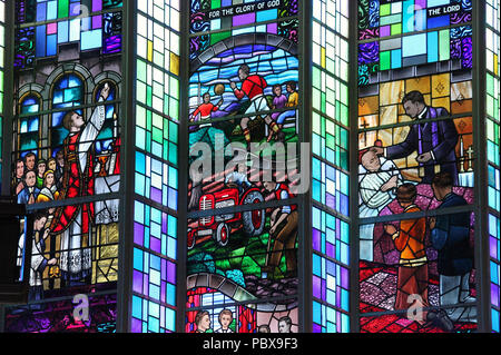 Stained glass window by Harry Clarke Studio at  All Saints Church in Drimoleague Stock Photo