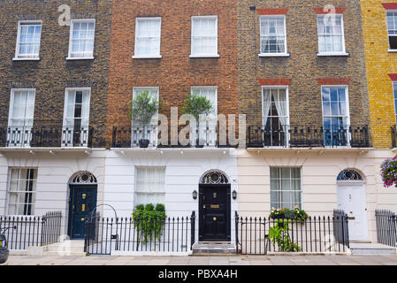 Facade of Georgian residential town houses made in yellow and red brick in a luxury residential area of West London. Stock Photo