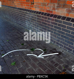 Sneaky dumping of rubbish on the street Stock Photo - Alamy