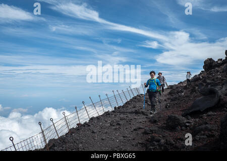 Walking on the summit of Mount Fuji (altitude 3776 meter) in Japan Stock Photo