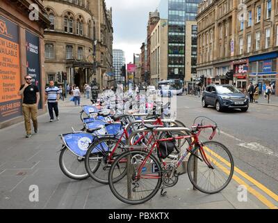 Hire bicycles on Hope Street, the most polluted city street for air quality in Glasgow, Scotland, UK Stock Photo