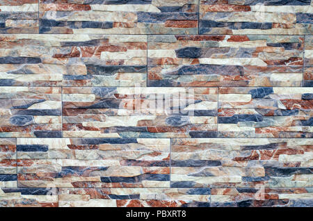 Close-up of stone wall pattern natural surface. Modern and creative interior and exterior Stock Photo