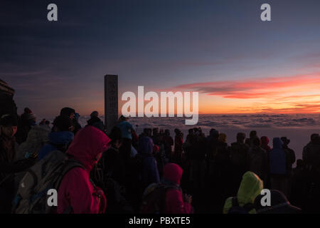 People Climb Mount Fuji In Fog Along The Yoshida Trail In Fujiyoshida 