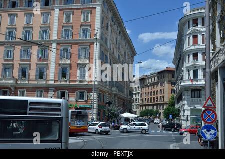 Beautiful Pink Coloured Commercial Building against the backdrop of Blue sky, near a street, Rome, Italy, Europe Stock Photo