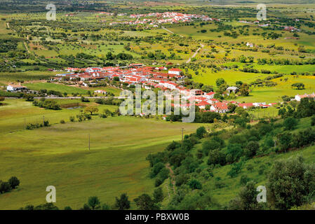 View to two villages in the middle of a wide flat and green landscape Stock Photo