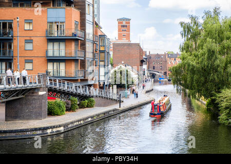 Birmingham canals. A narrowboat navigating the Worcester and Birmingham Canal in Birmingham, England, UK Stock Photo