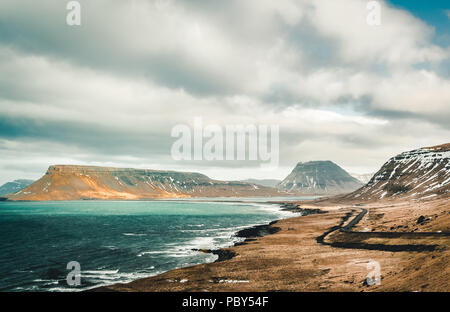 Kirkjufellsfoss and Kirkjufell Icelandic, Church mountain , a 463 m high mountain on the north coast of Iceland's Snaefellsnes peninsula, near the town of Grundarfjordur, Iceland Stock Photo