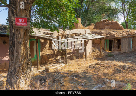 RANCHOS DE TAOS, NM, USA-13 JULY 18: A collapsed residence in Rancho de Taos, a few yards from the San Francisco de Asis Mission. Stock Photo