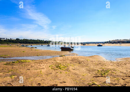 Boats on the beach in the Torridge estuary at Instow, Devon, UK, at low tide, looking upriver Stock Photo